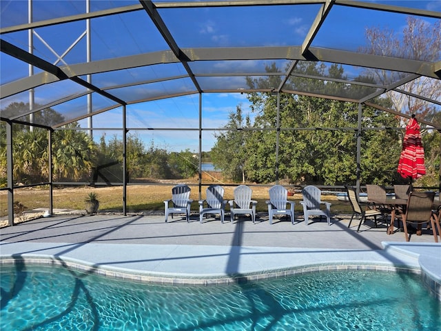 view of pool with a patio area and a lanai