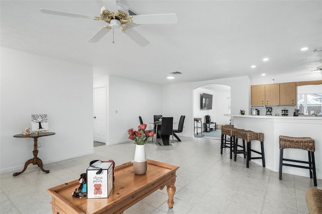 living room with ceiling fan