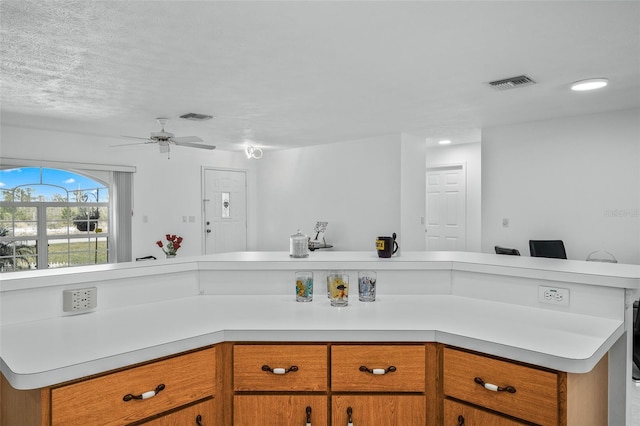 kitchen featuring ceiling fan