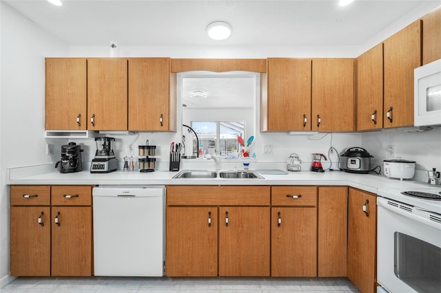 kitchen featuring sink and white appliances