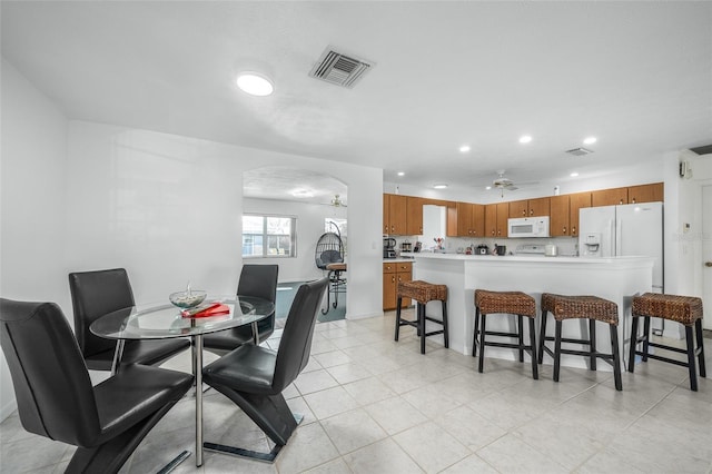 dining space with ceiling fan