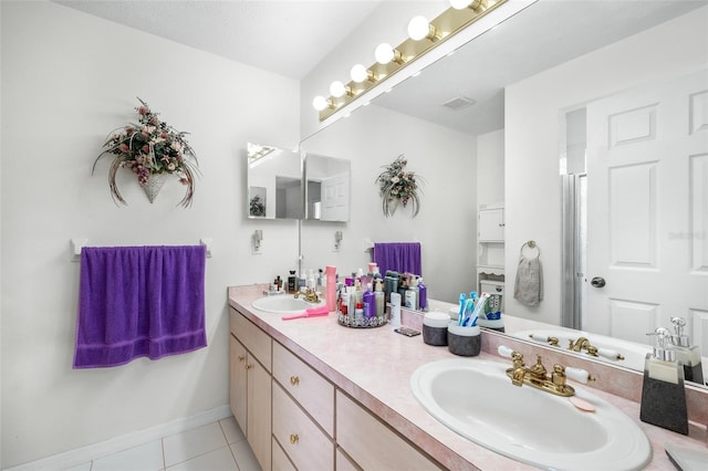 bathroom with vanity and tile patterned flooring