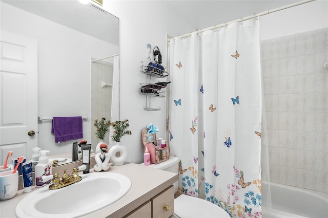 full bathroom with toilet, vanity, and shower / tub combo with curtain