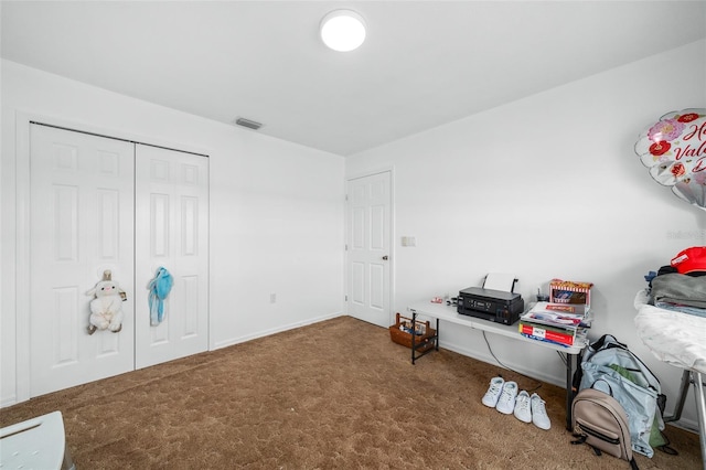 miscellaneous room with carpet flooring