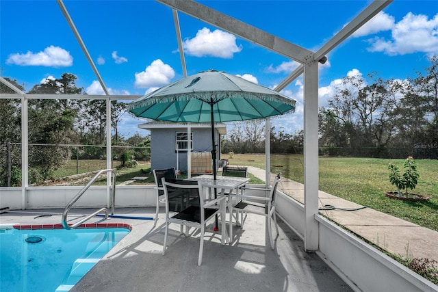 view of pool featuring a lawn and a patio area