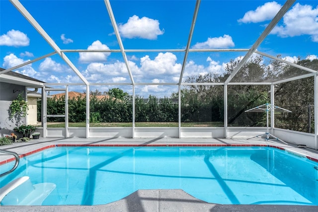 view of pool with a lanai