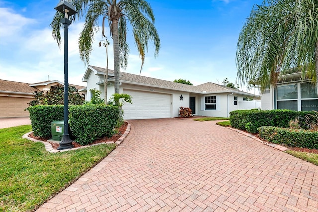 ranch-style house featuring a garage