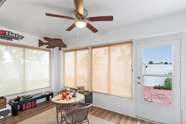 sunroom featuring ceiling fan