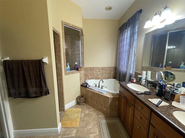 bathroom with plus walk in shower, tile patterned flooring, and vanity