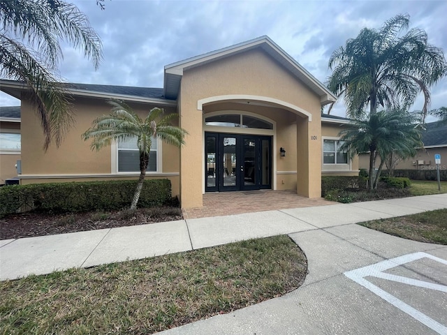 property entrance featuring french doors