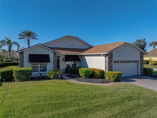 ranch-style house with a garage and a front lawn