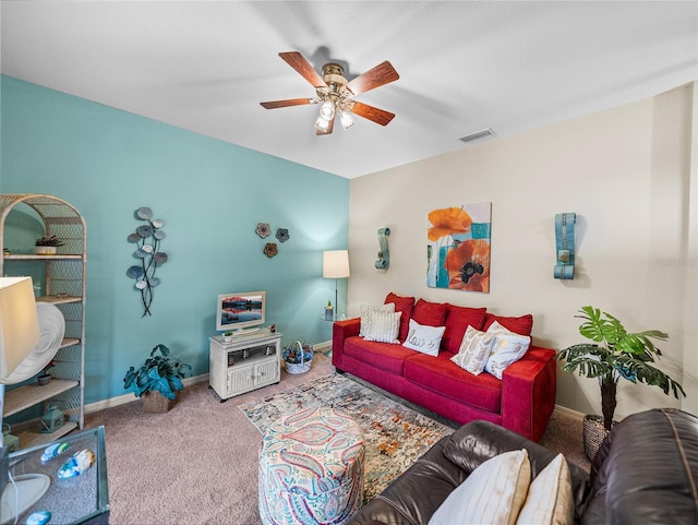 living room with carpet floors and ceiling fan