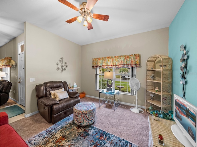 interior space featuring ceiling fan and carpet