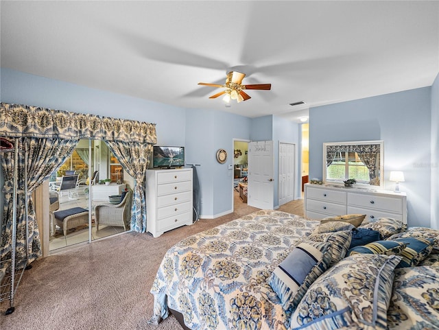 bedroom featuring light colored carpet, a closet, and ceiling fan