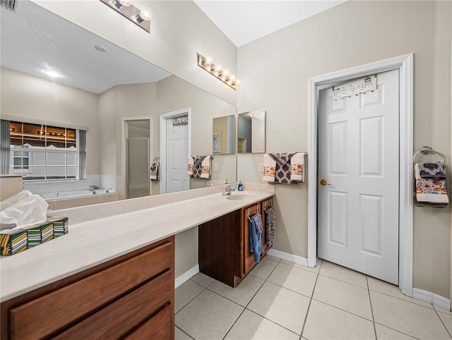 bathroom with tile patterned flooring, vanity, and an enclosed shower