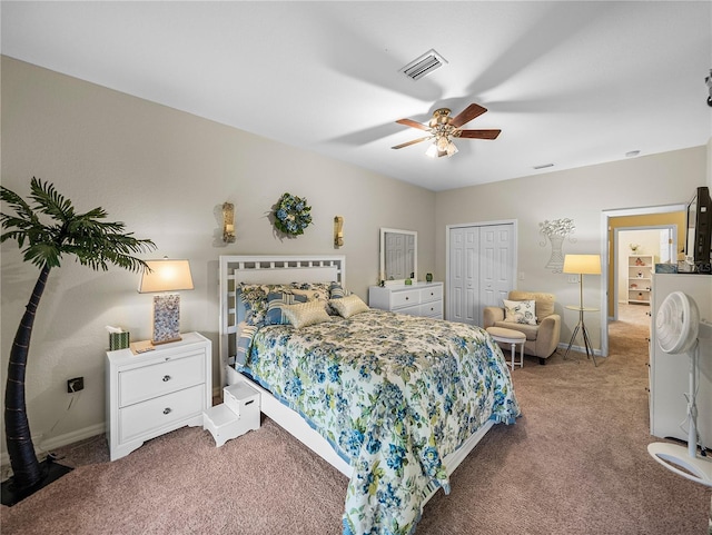 carpeted bedroom with ceiling fan and a closet