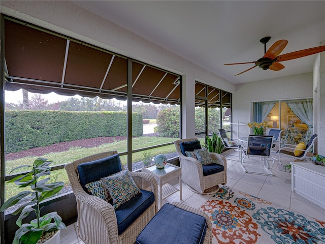 sunroom featuring ceiling fan