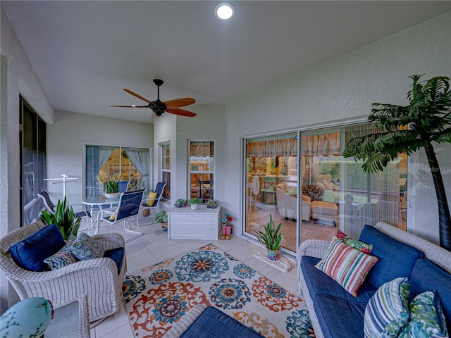 view of patio with ceiling fan and an outdoor living space