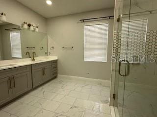 bathroom with vanity and walk in shower