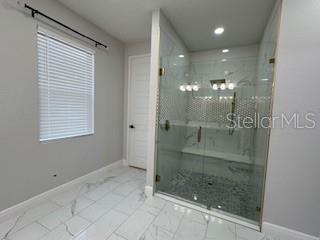 bathroom featuring walk in shower