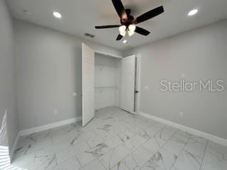 unfurnished bedroom featuring a closet and ceiling fan