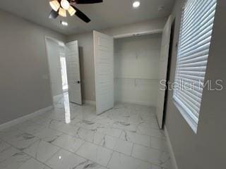 unfurnished bedroom featuring ceiling fan