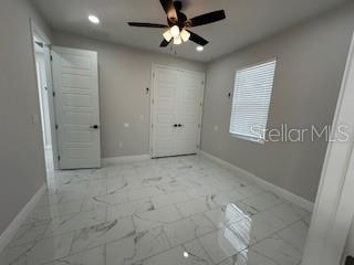 unfurnished bedroom with ceiling fan