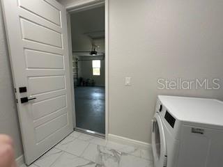 laundry room featuring washing machine and dryer