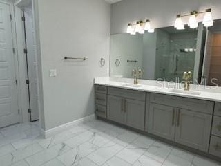 bathroom featuring vanity and a shower with door