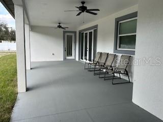 view of patio featuring ceiling fan and a porch