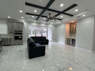 living room featuring coffered ceiling, beam ceiling, and french doors