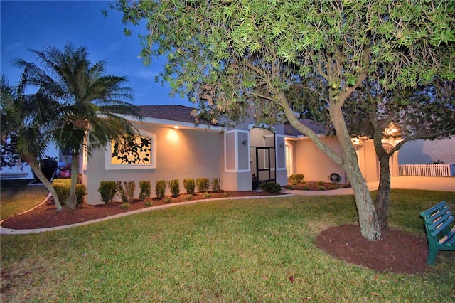 view of front of home with a front lawn