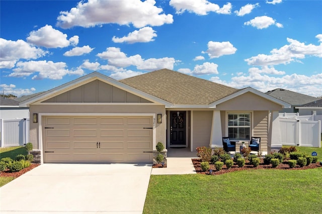 view of front of property with a garage and a front yard