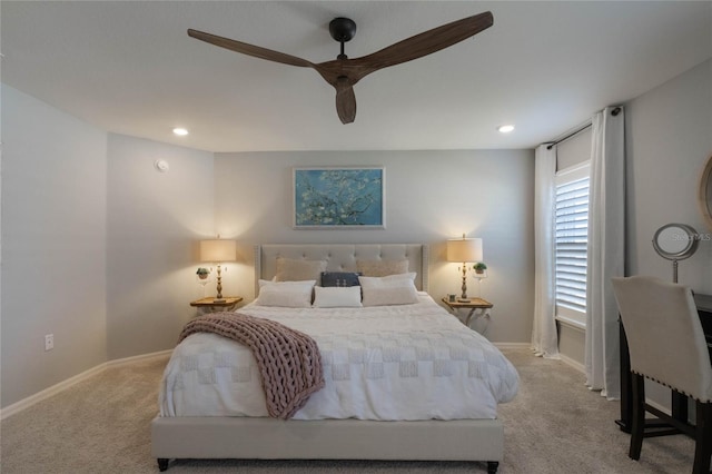 bedroom with ceiling fan and light colored carpet