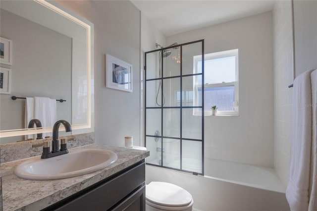 full bathroom featuring enclosed tub / shower combo, vanity, and toilet