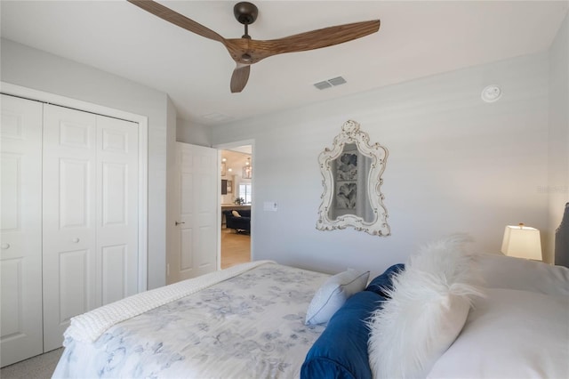 bedroom featuring ceiling fan, a closet, and visible vents