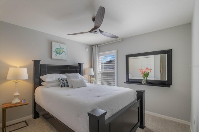 bedroom featuring light carpet, a ceiling fan, and baseboards