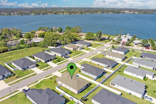 bird's eye view with a residential view and a water view