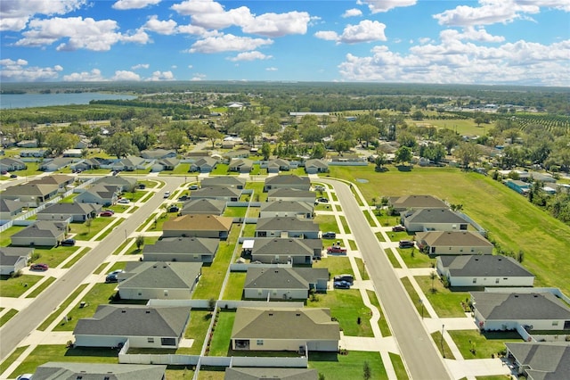 birds eye view of property with a residential view and a water view