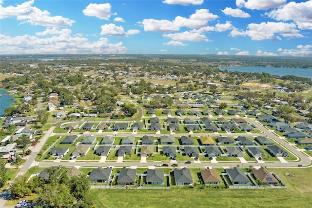 aerial view featuring a water view and a residential view