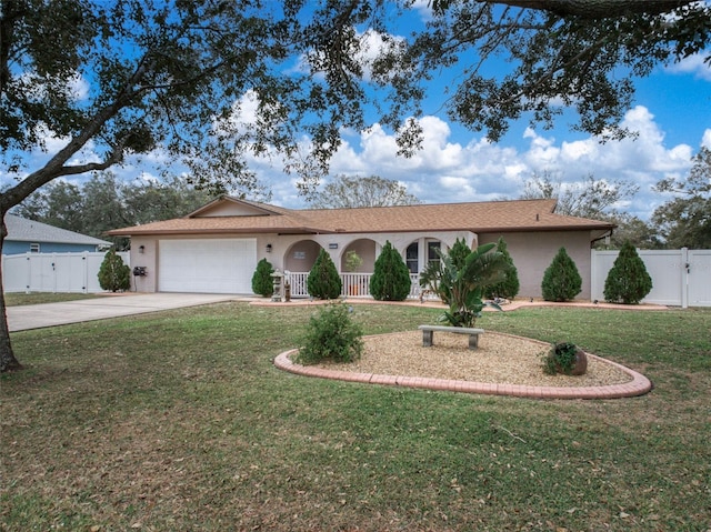 single story home featuring a front yard and a garage