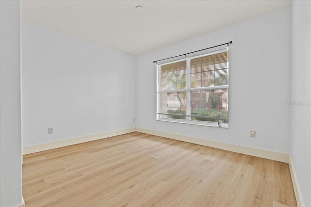 unfurnished room with light hardwood / wood-style flooring