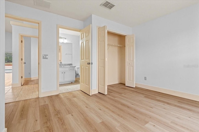 unfurnished bedroom featuring light hardwood / wood-style flooring