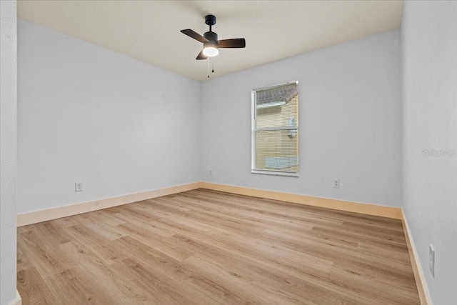 spare room featuring ceiling fan and light wood-type flooring