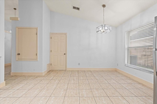 spare room with lofted ceiling, light tile patterned floors, and a notable chandelier