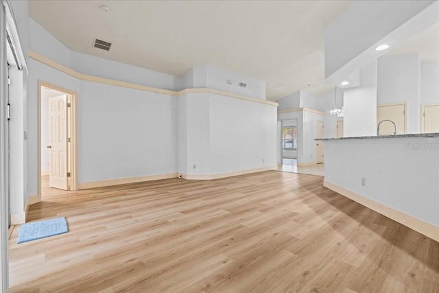 unfurnished living room featuring light wood-type flooring