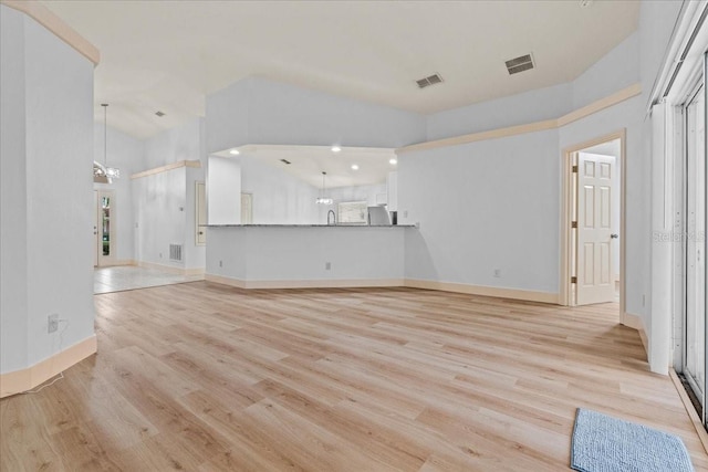 unfurnished living room with light wood-type flooring