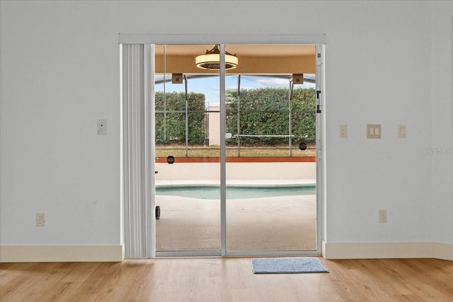 doorway to outside with hardwood / wood-style flooring