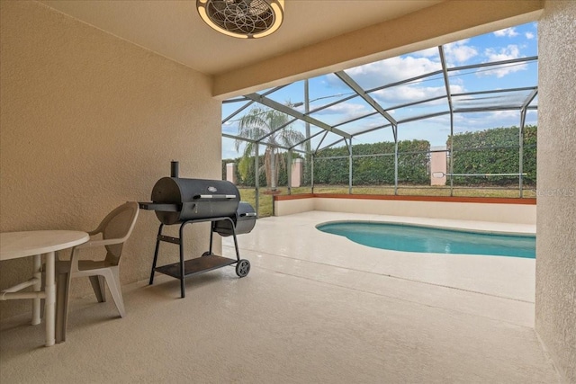 view of pool featuring a lanai, area for grilling, and a patio