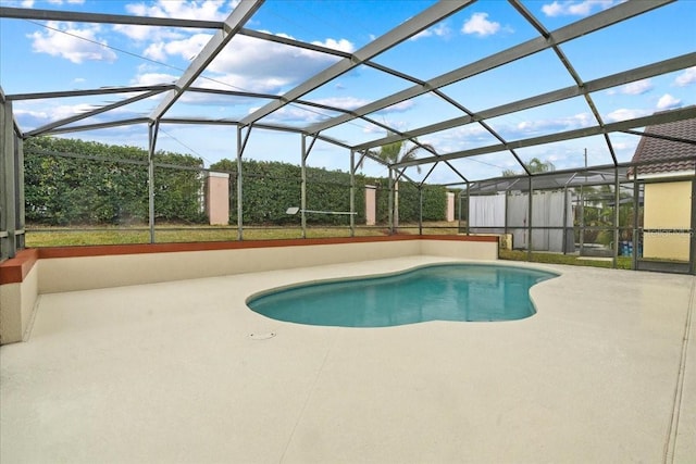 view of pool featuring a lanai and a patio